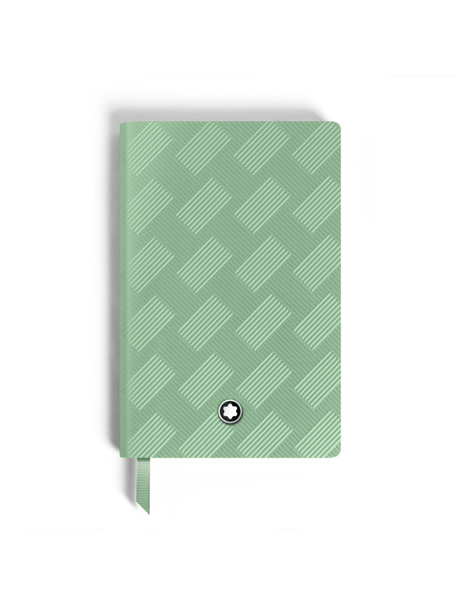 Cuaderno pequeño verde páginas con líneas