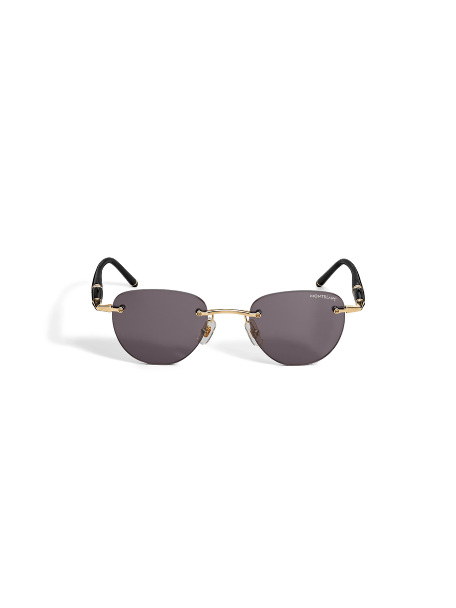 Lentes de sol redondos con montura metálica dorada