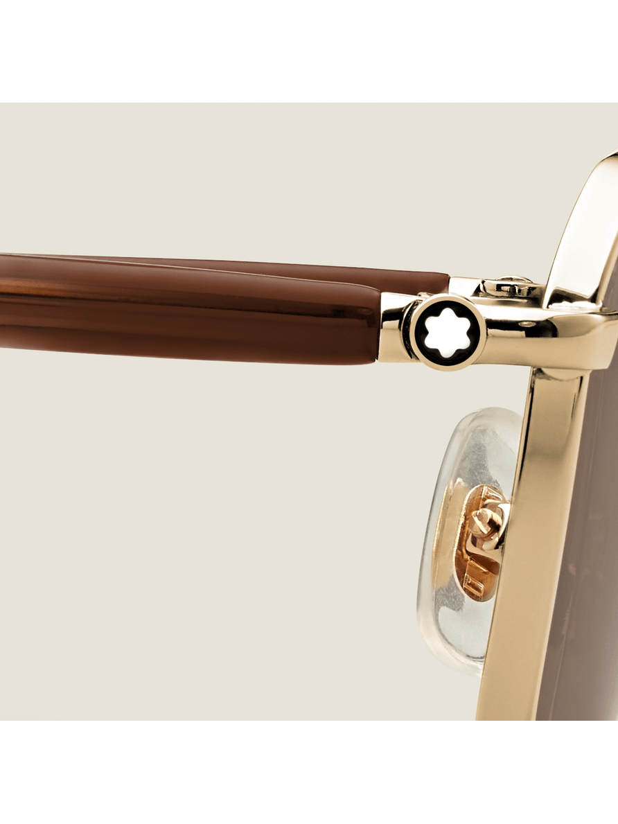 Lentes de sol rectangulares con montura metálica dorada