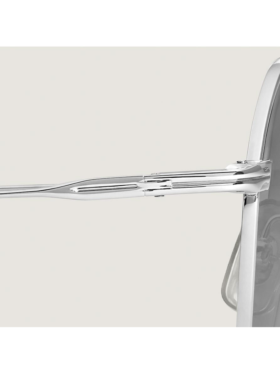 Lentes de sol redondos con montura metálica plateada